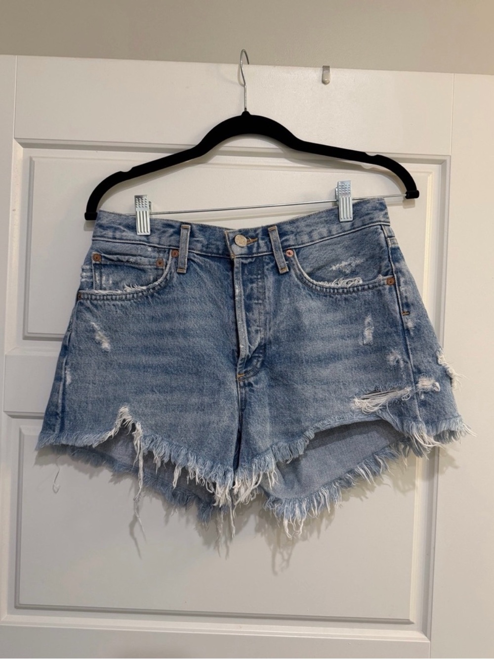Agolde Light Blue Distressed Denim Shorts with Frayed Hem